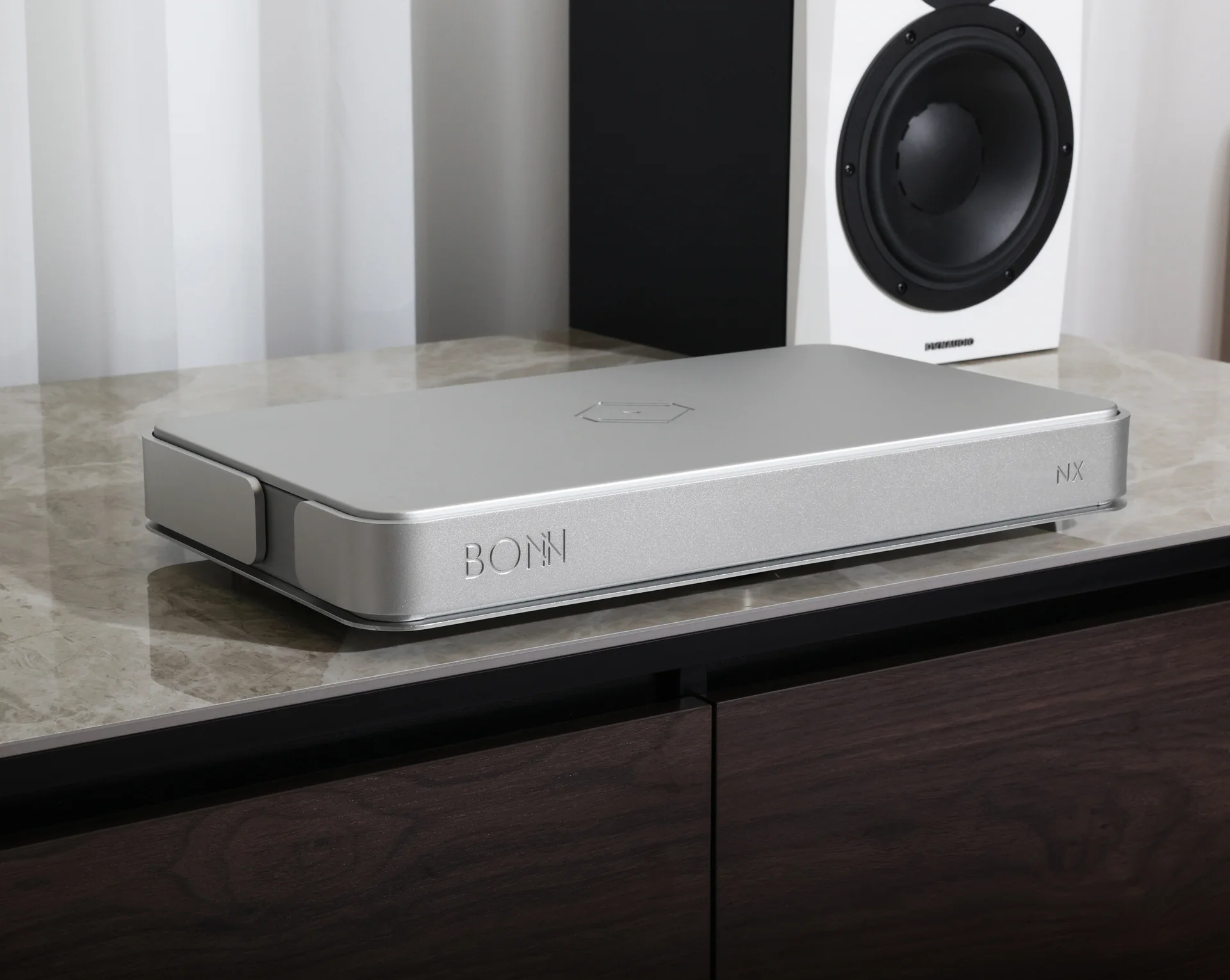 Silent Angel Bonn NX Network Switch on side-board with Dynaudio loudspeakers