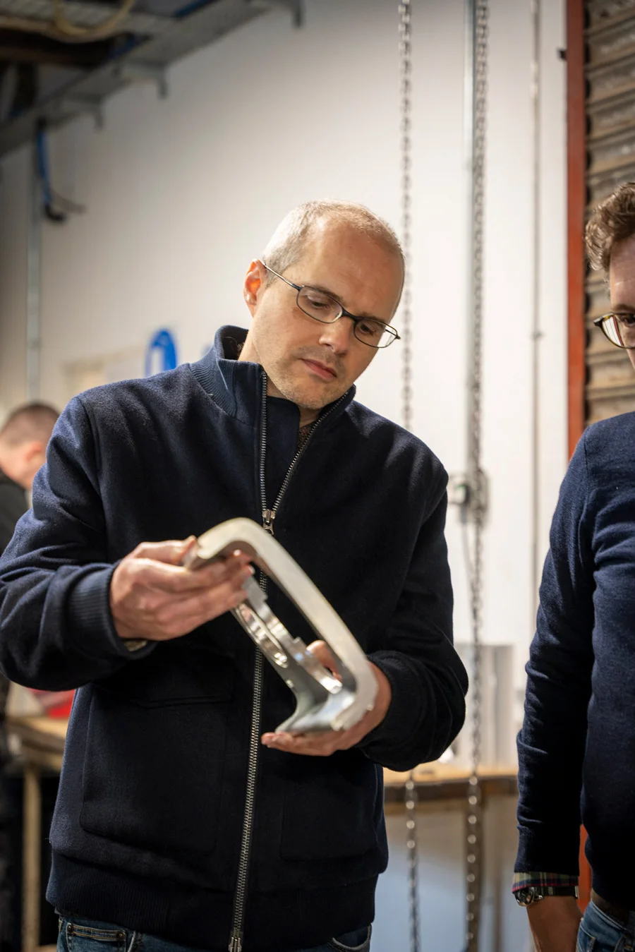 Bryan with the front baffle from a Precision Series 1.0, machined from a single billet of aluminium to the same exacting standards as the Fibonacci Series.