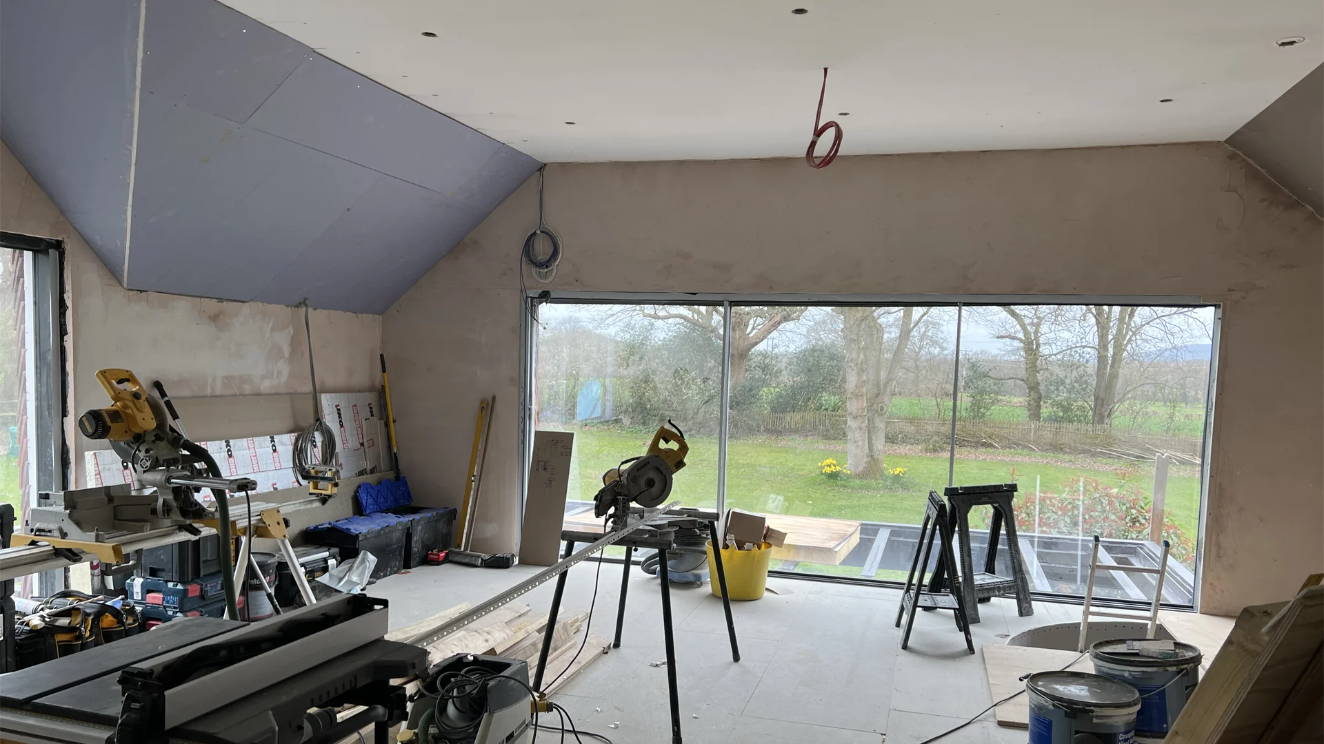 The room to be transformed, showing building work and 1st fix of audio and video cables