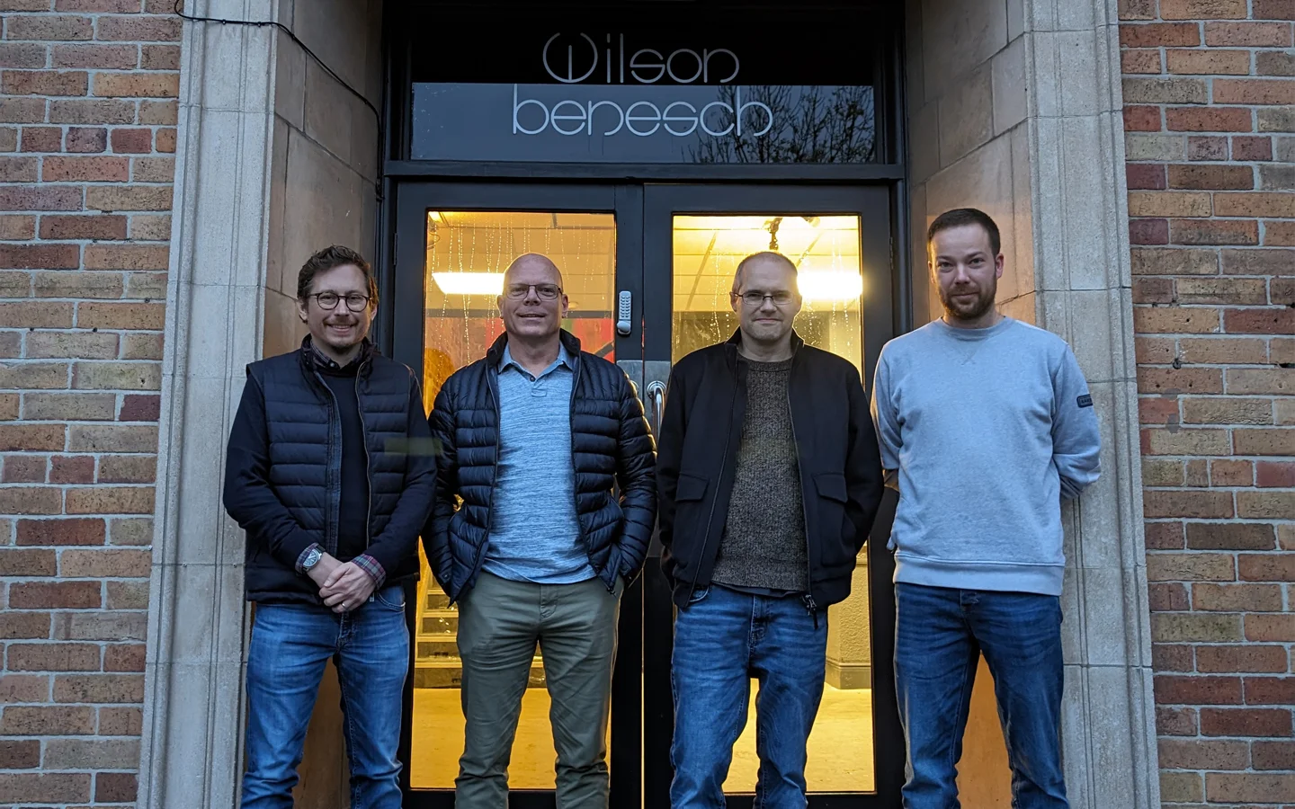 The Audiobarn team, standing outside the Wilson Benesch Headquarters building